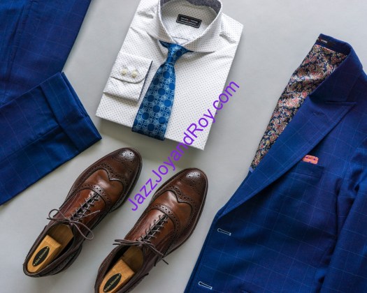 blue and white necktie beside brown leather shoes